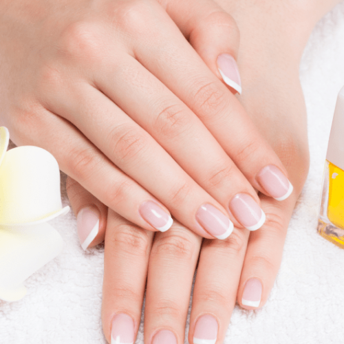 woman-nail-salon-receiving-manicure-by-beautician-beauty-treatment-concept 2-min