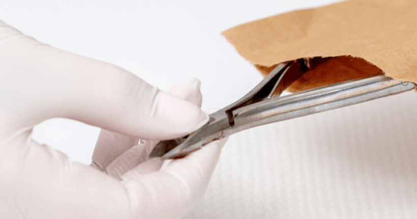 hands-are-taking-manicure-tools-from-craft-envelope-before-manicure-procedure 2-min